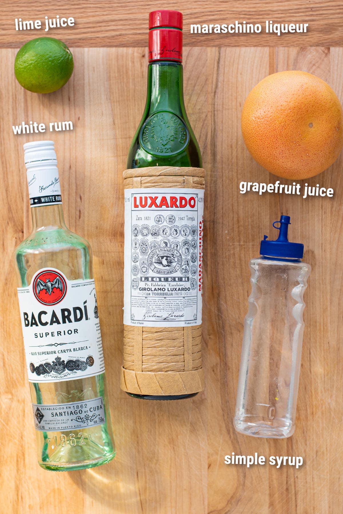 Hemingway Daiquiri cocktail ingredients laid out on a wooden cutting board.