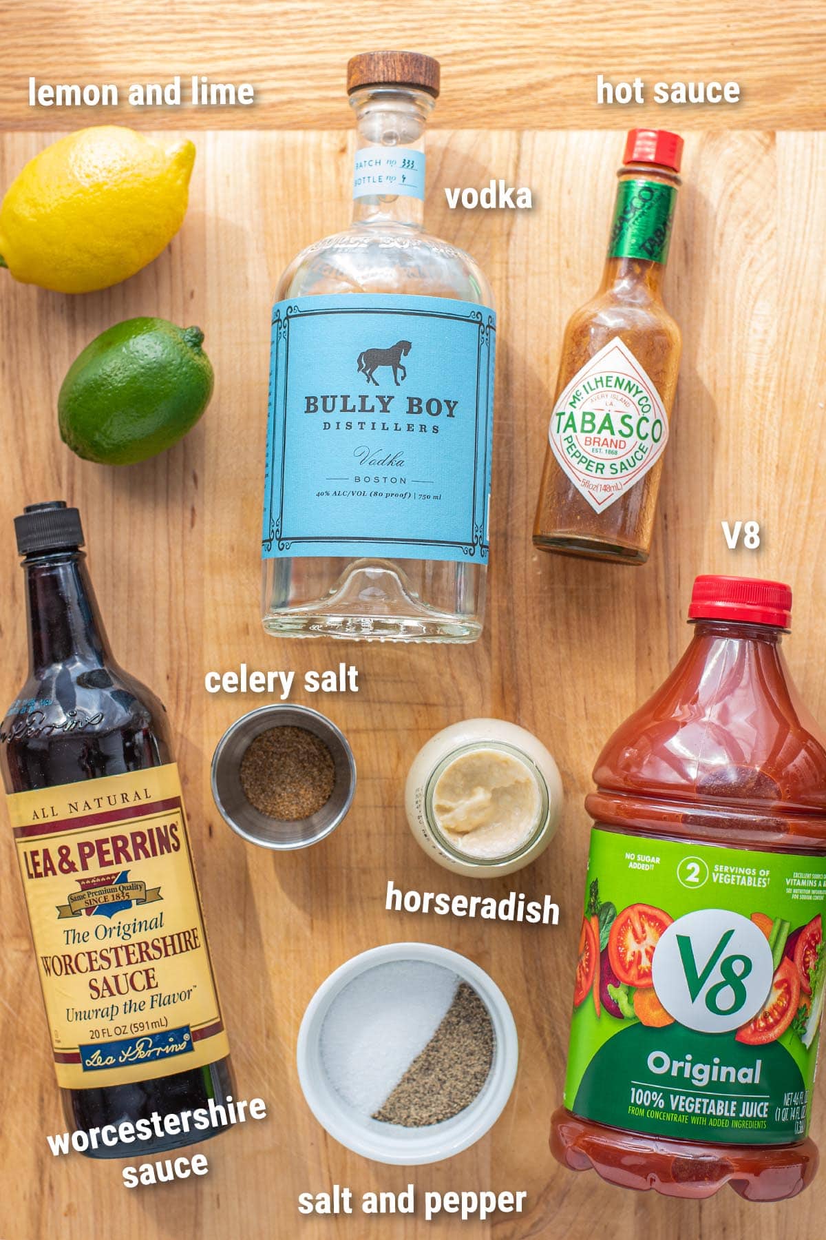 All ingredients to make homemade Bloody Mary mix laid out on a cutting board.
