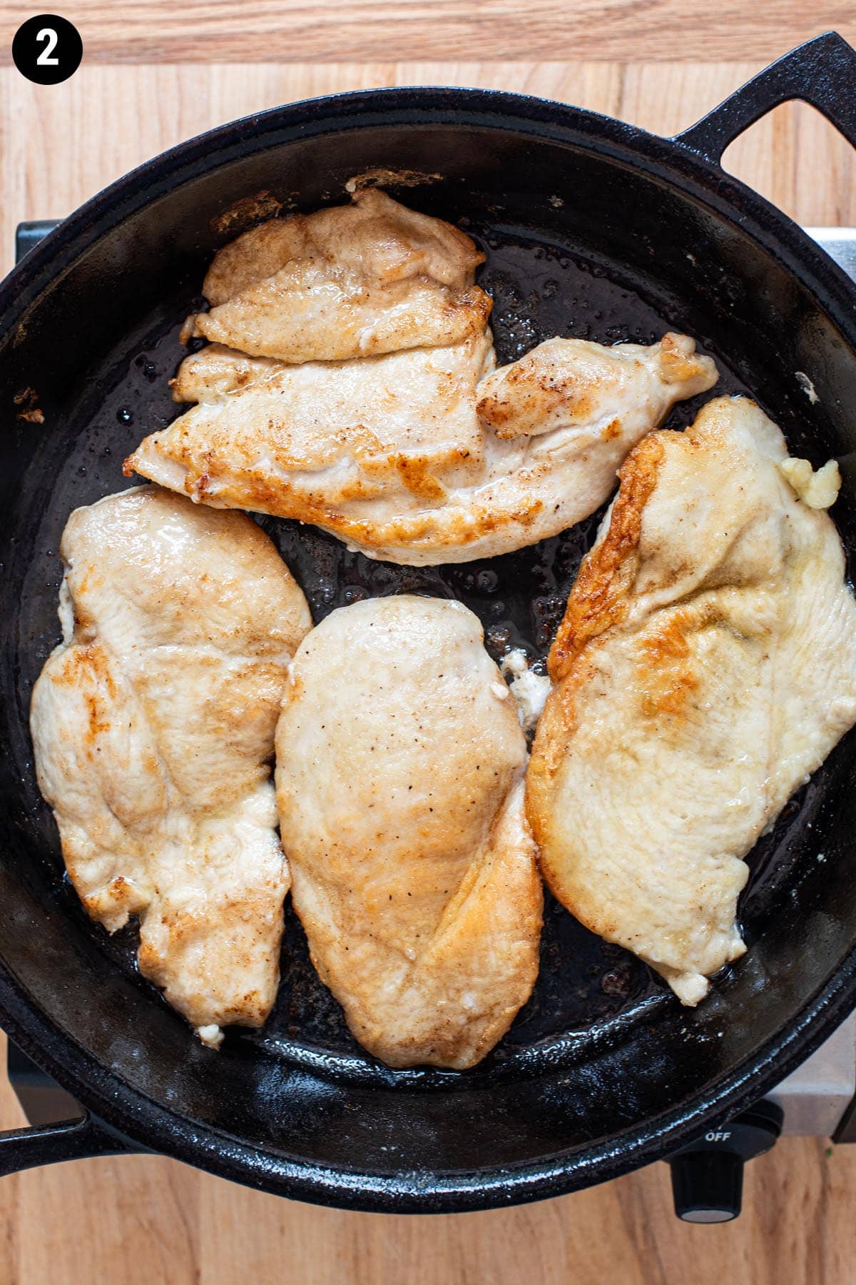 Pan searing chicken cutlets in as cast iron skillet.