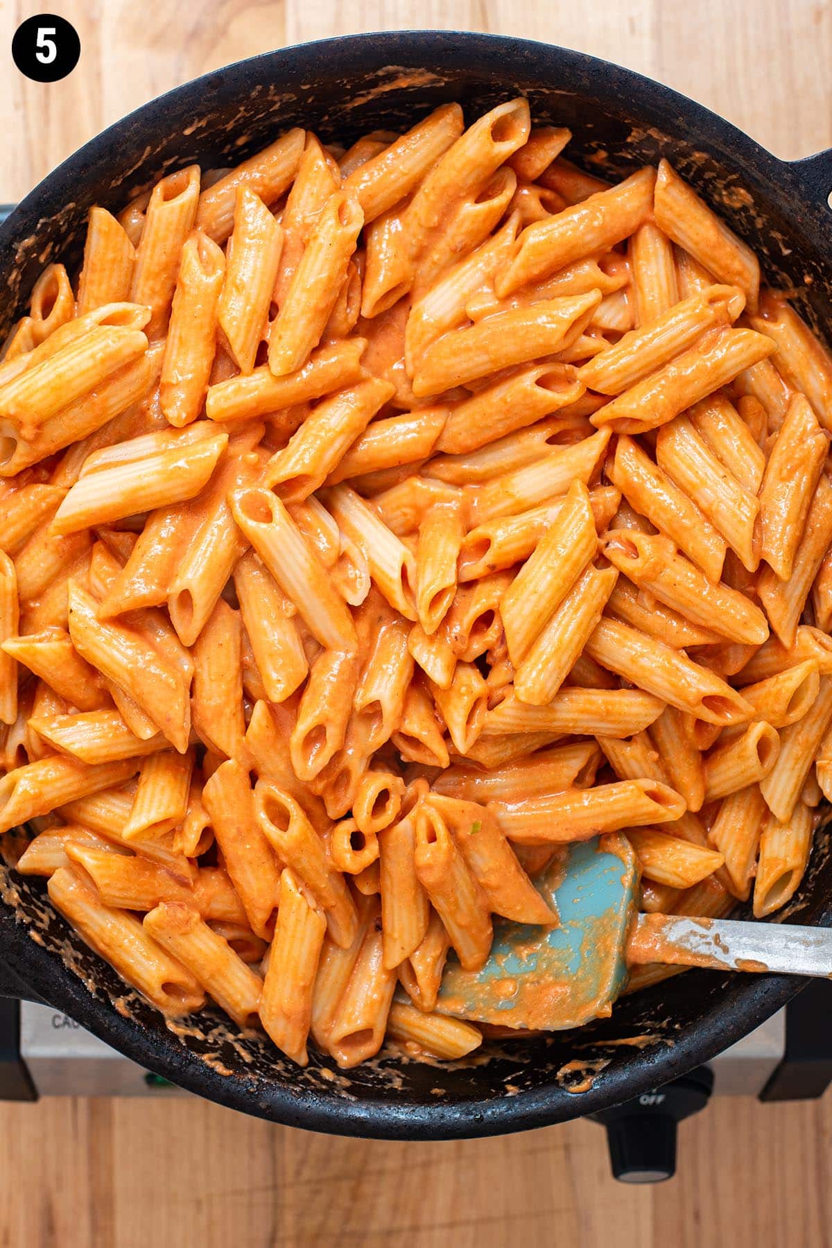 Creamy penne alla vodka in a cast iron skillet.