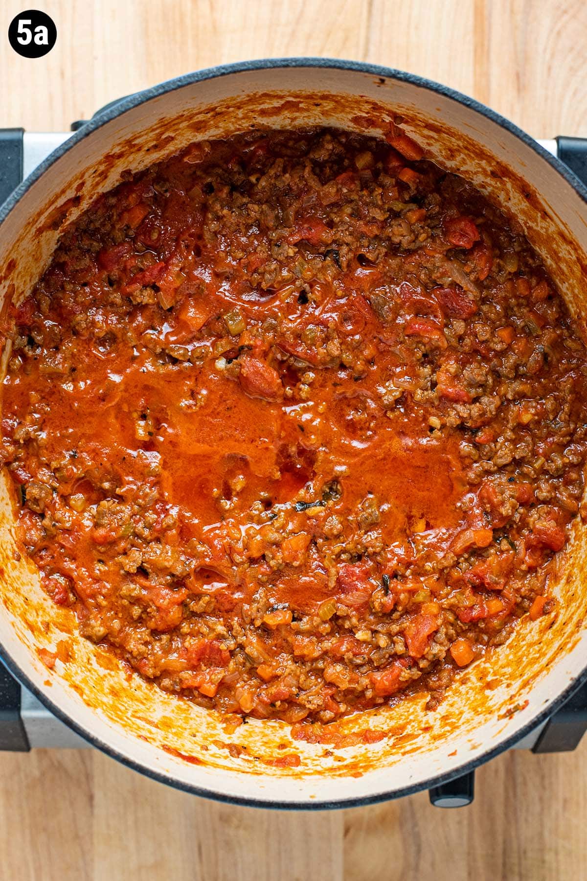 Finished Bolognese sauce in a Dutch oven after it has been simmered for 3 hours.