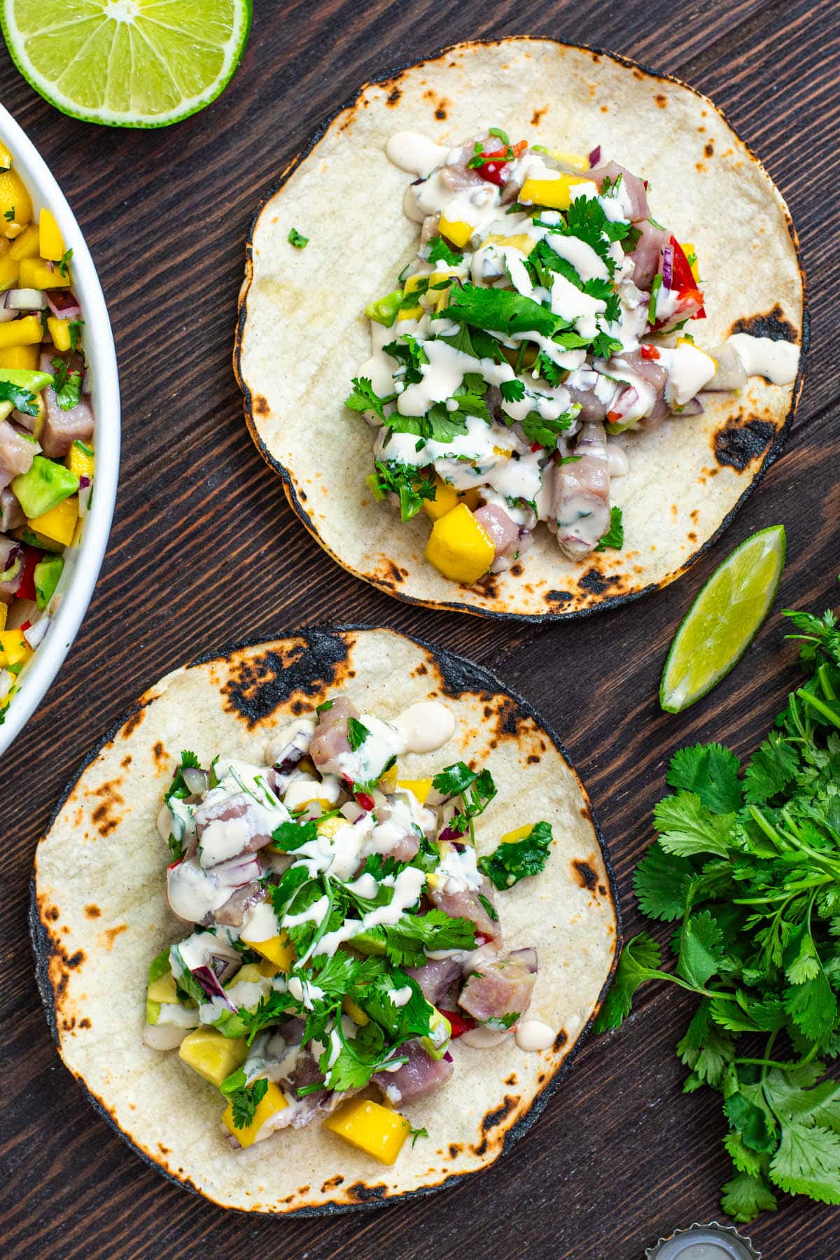 Tuna ceviche with mango served on a corn tortilla with a drizzle of creamy mayo soy sauce.